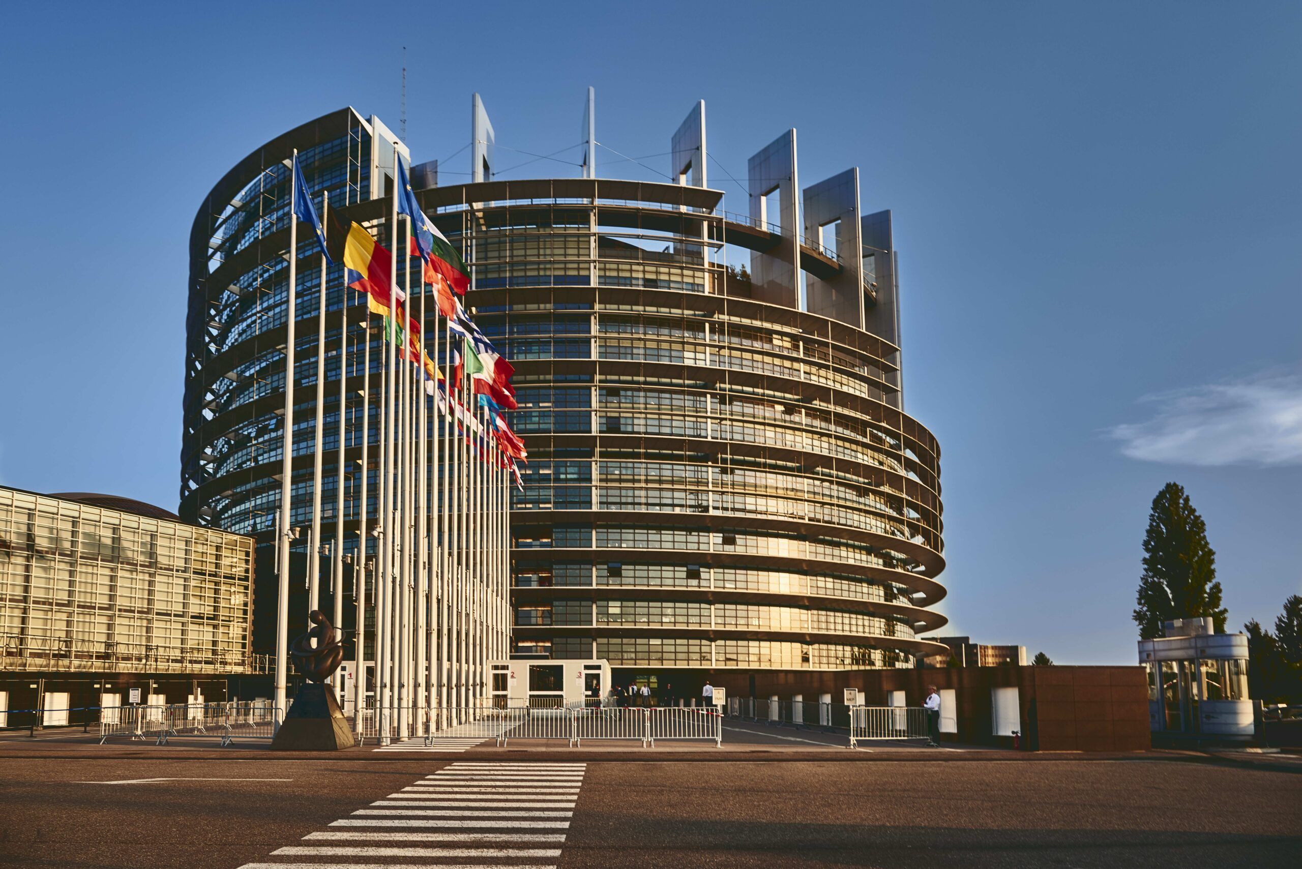 The European Parliament building in Strasbourg, France with a clear blue sky in the background